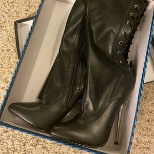 Devious thigh high dagger heels